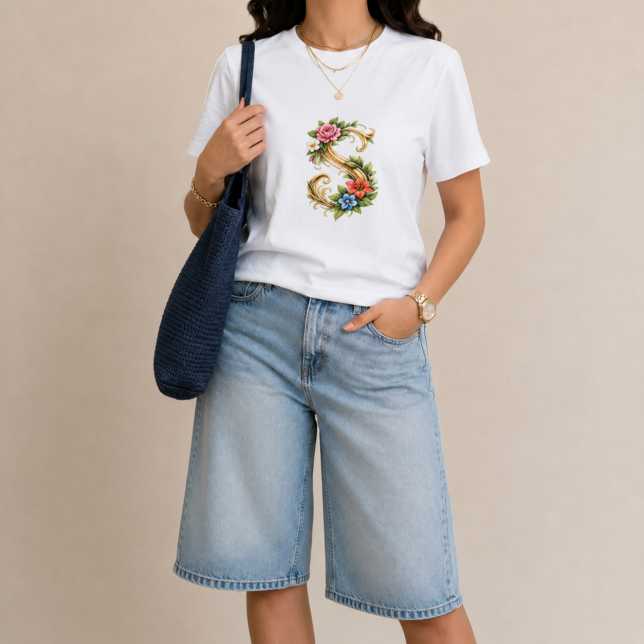 white-tee-ornate-s-letter-woman..webp